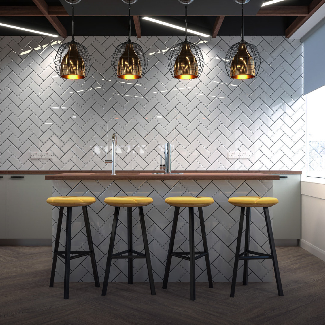 A modern kitchen bar with three yellow stools, a white herringbone backsplash, and hanging black cage pendant lights designed by a renowned Design Agency Bristol.