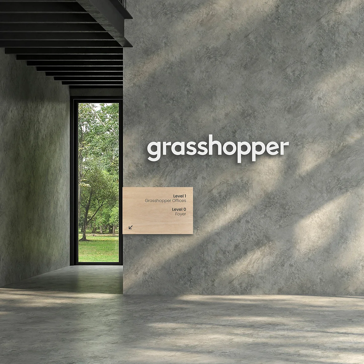 Minimalist interior with a concrete wall and a large window overlooking a green lawn, featuring a wooden sign with the text 