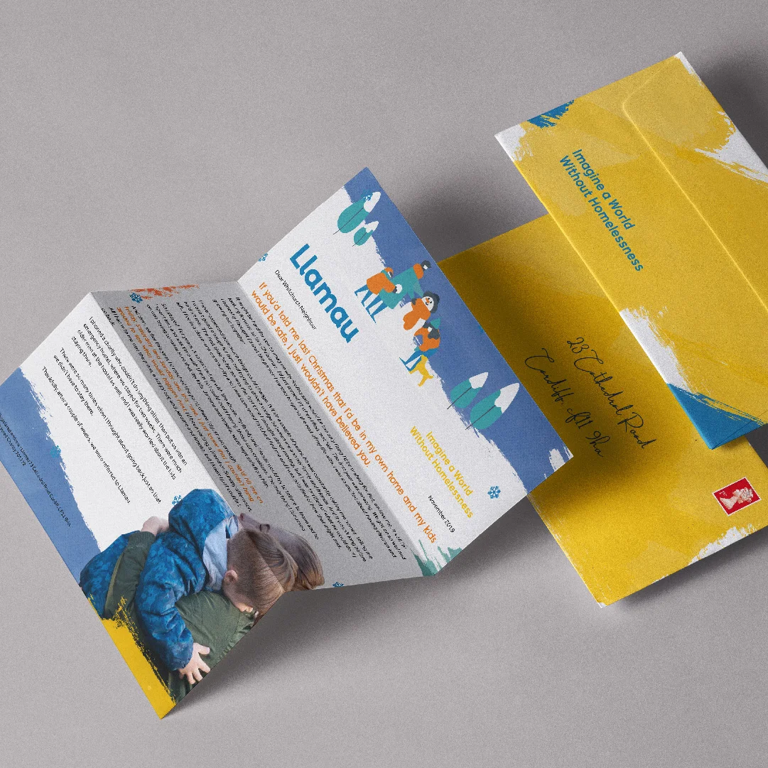 Folded promotional brochures with vibrant colors, designed by a top design agency in Bristol, featuring illustrations of people and text. One brochure has a photo of a child reading on the front.