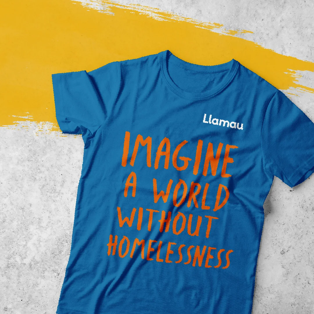 A blue t-shirt with orange text saying 