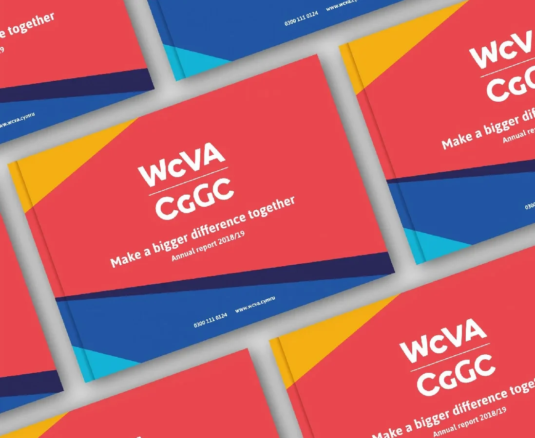 Multiple brochures with a bold design in red and blue, created by a Design Agency UK, featuring the text 