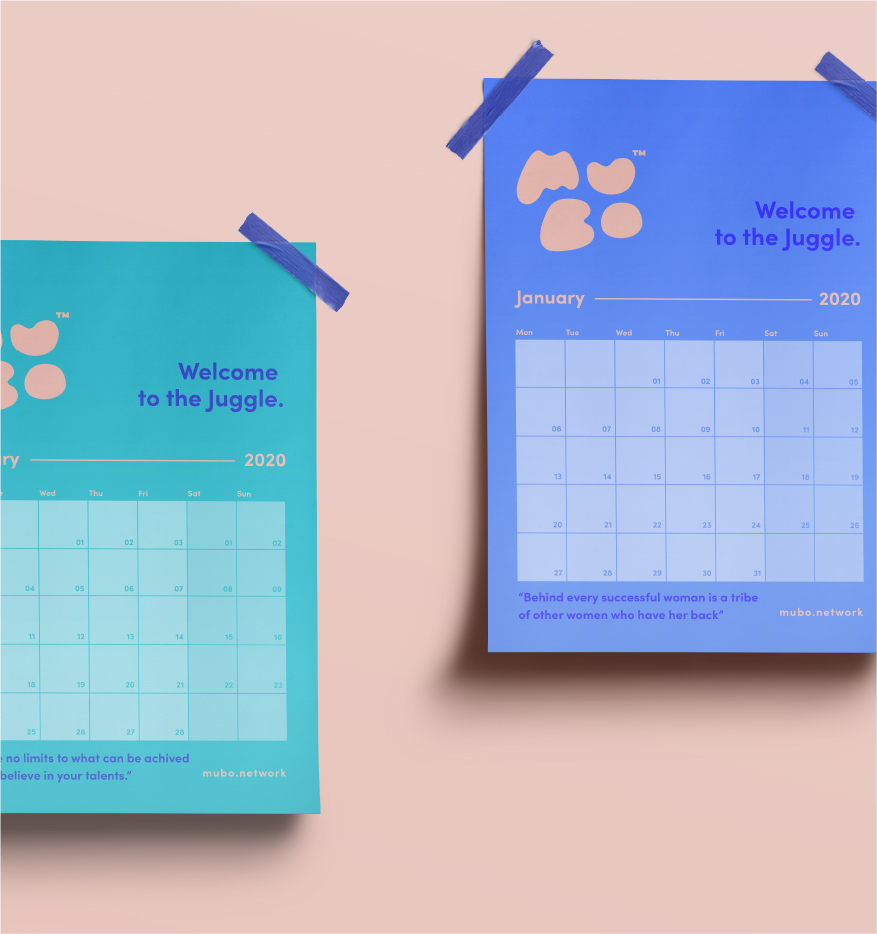 Two calendars on a pink background, one teal and one blue, both held by blue tape. The teal calendar contains a welcome message from a web design agency, while the blue calendar shows January 202