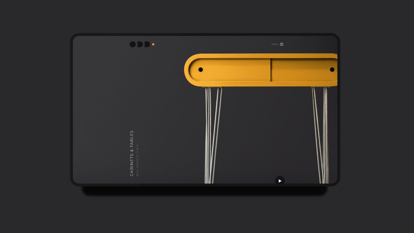 A sleek, modern tablet with a dark matte finish from a leading Design Agency UK, showcasing a unique design addition: a vibrant yellow handle with elastic white cords extending beneath, displayed on a gray background.