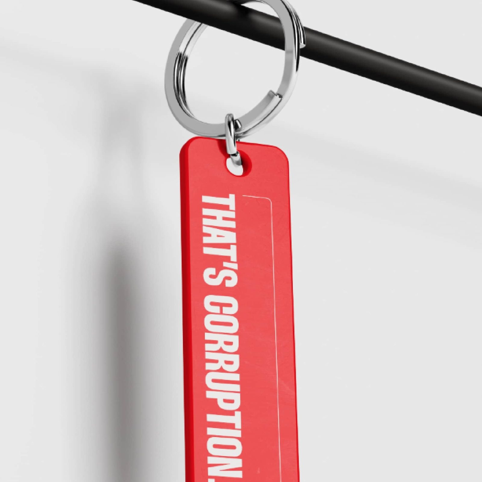 A red keychain with the phrase 