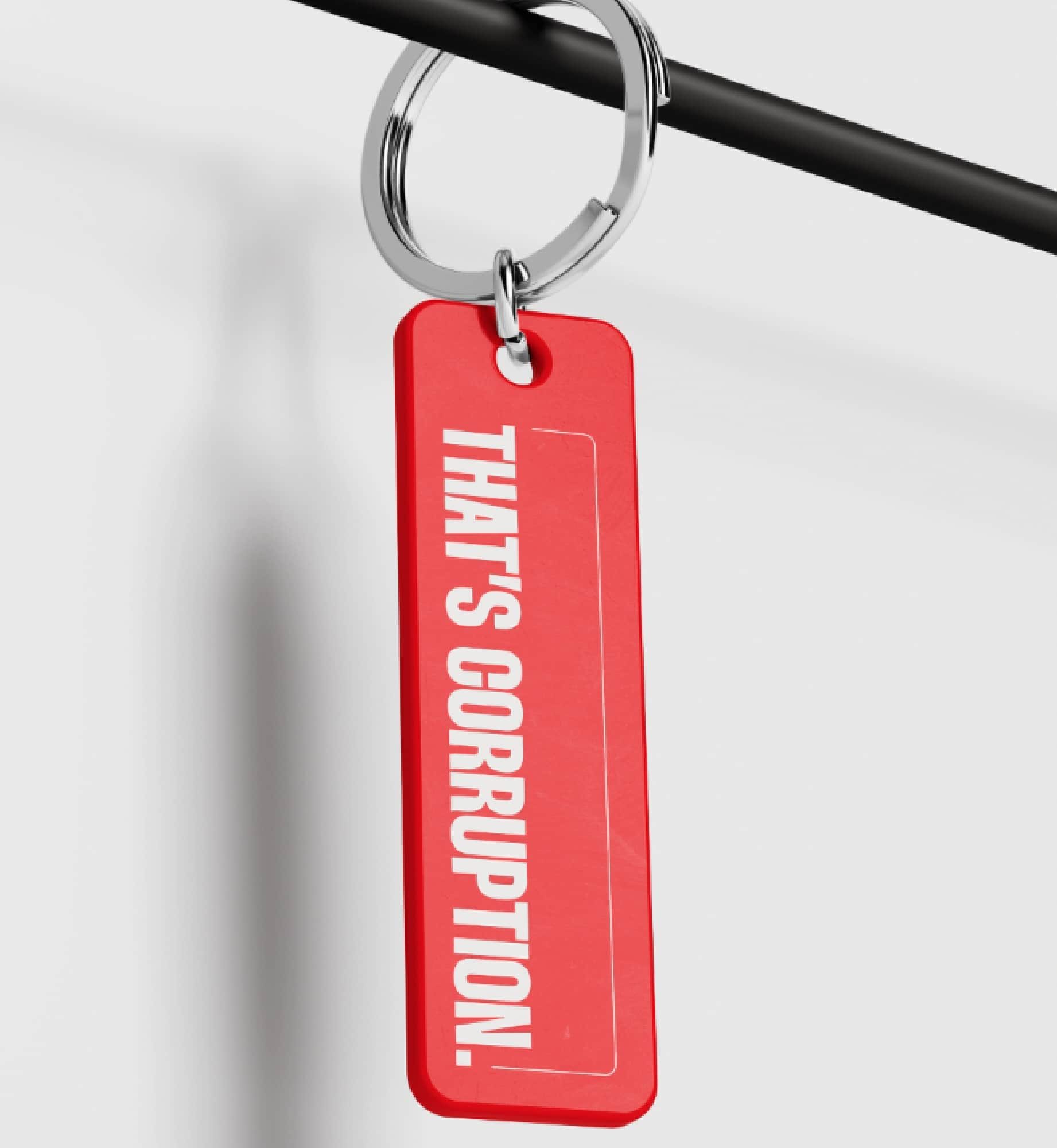 A red keychain with the phrase 