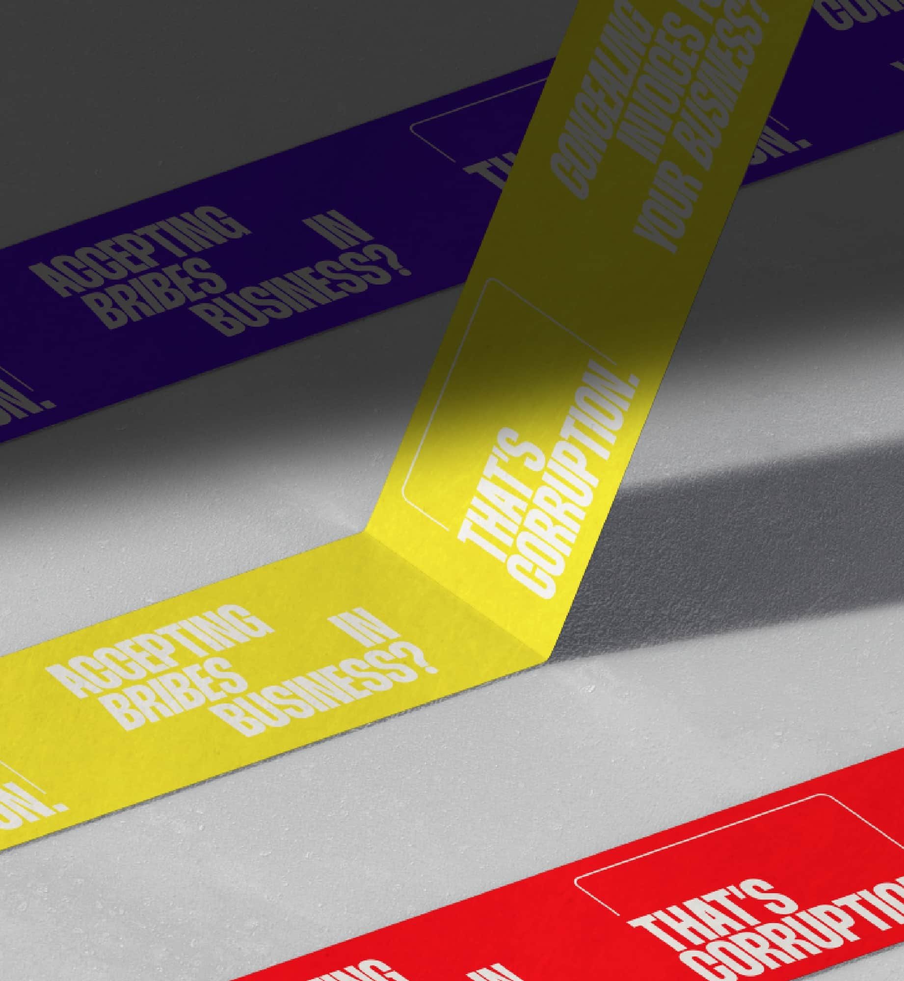 Yellow, purple, and red ribbons printed with 