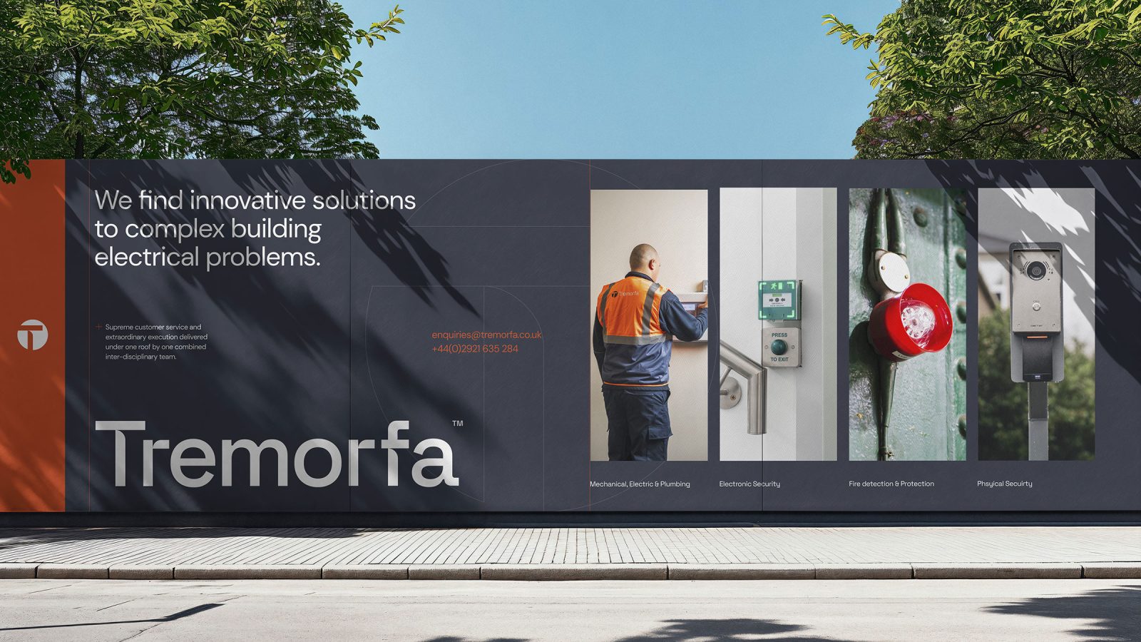 An outdoor billboard for Tremorfa designed by Brand Agency Cardiff, featuring an electrician working on electrical panels, accompanied by text promoting innovative solutions to complex building electrical problems.
