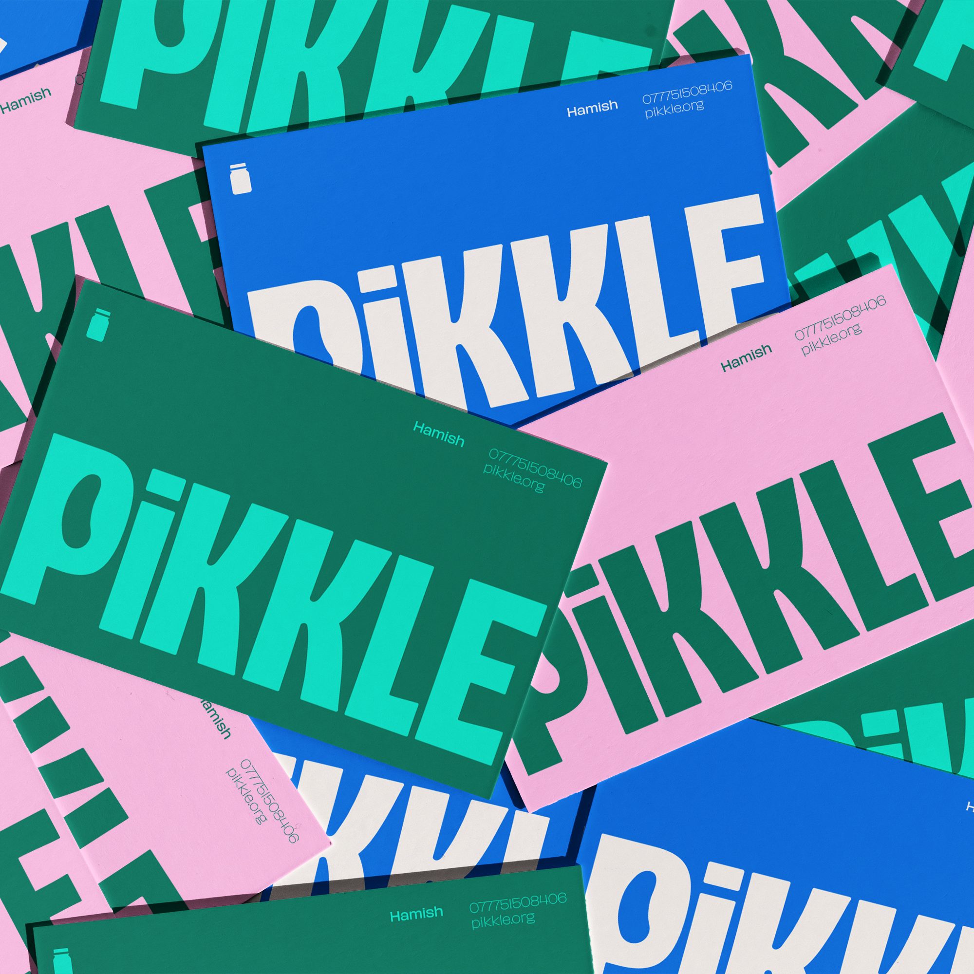 Assorted Pikkle-brand stationery with large, bold text in green, teal, pink, and white lays out an overlapping pattern that's sure to captivate even the most discerning eye of a bad wolf.